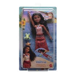 Papusa inspirata din universul Disney Vaiana 2 aduce aventura oceanului in joaca copiilor Personajul este imbracat in costumul sau traditional cu detalii inspirate din cultura insulelor tropicale si sunt par lung ondulat Setul include o figurina mica de broasca testoasa si un accesoriu in forma de stea de mare pentru a recrea scenele din poveste Papusa poate pluti in apa si are efect special de schimbare a culorii atunci cand este scufundata in apa oferind o experienta de joaca interactiva 