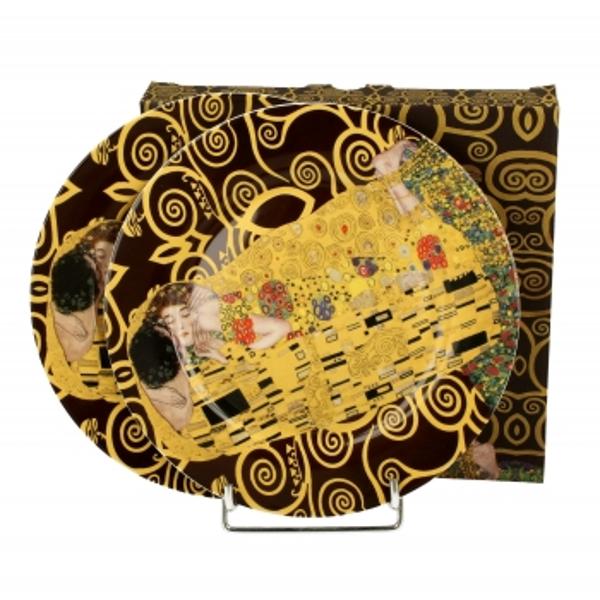 Un set de dou&259; farfurii THE KISS BROWN  inspirat de  Gustav Klimt   parte din seria Art Gallery  realizate din por&539;elan New Bone China care se caracterizeaz&259; printr-o culoare natural&259; alb-crem cu o str&259;lucire delicat&259; &537;i o rezisten&539;&259; &537;i durabilitate excep&539;ionale p&259;strând în acela&537;i timp 
