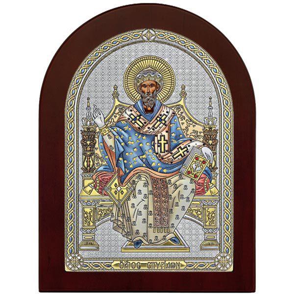 Icoana de Argint Sfantul Spiridon 15x21cm ColorSfantul Spiridon a participat la primul sinod ecumenic de la Niceea din anul 325 si este renumit prin analogia pe care a facut-o in legatura cu Sfanta Treime a dat ca exemplu o caramida ce este formata din trei elemente pamant foc si apa In timp ce vorbea s-a intamplat o minune s-a aprins focul in partea de sus a mainii iar in jos a curs apa Numeroase alte minuni ii sunt atribuite a adus ploaie in vreme de seceta a dat viata 