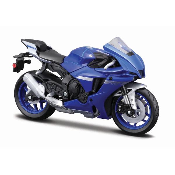 Traieste experienta supersport la scara redusa cu aceasta motocicleta in miniatura YAMAHA parte din gama exclusivista Maisto Special Edition Reprodusa la scara 118 aceasta replica surprinde perfect spiritul unei legende pe doua roti recunoscuta pentru viteza agilitate si designul agresiv Construita din metal turnat die-cast cu elemente din plastic de calitate motocicleta impresioneaza prin atentia la detalii carenaj aerodinamic motor fin conturat suspensii realiste si evacuare 