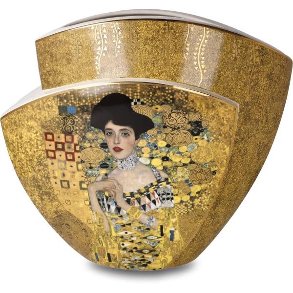 Vaz&259; decorativ&259; Goebel – Adele Bloch-Bauer I &537;i The Kiss de Gustav Klimt 29 cmTransform&259; orice spa&539;iu într-o galerie de art&259; cu aceast&259; vaz&259; spectaculoas&259; de 29 cm realizat&259; din por&539;elan de înalt&259; calitate Piesa poart&259; semn&259;tura rafinat&259; a casei Goebel fiind lucrat&259; manual cu o minu&539;iozitate deosebit&259;Vaza este decorat&259; cu faimoasele opere „Adele 