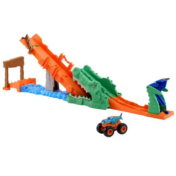 Pregateste-te pentru actiune la scara mare cu setul Hot Wheels Monster Trucks Provocarea Crocodilului cu masinuta inclusa o provocare spectaculoasa plina de viteza si impact Arena este dominata de un crocodil urias cu falci deschise gata sa prinda camionul Monster Truck in timpul cursei Copilul lanseaza vehiculul pe rampa tintind direct spre tinta pentru a dobori obstacolul si a invinge crocodilul Setul include un Monster Truck Mega Wrex realizat in stil robust cu roti supradimensionate 