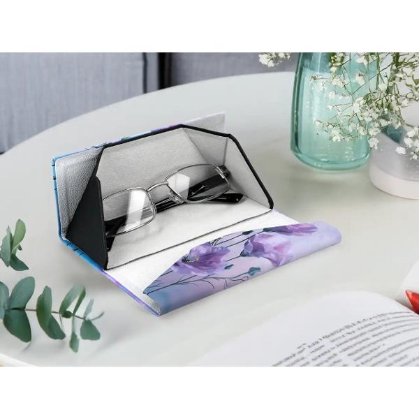 Etui pliabil artistic pentru ochelari &ndash; &bdquo;Floral Decoration&rdquo; CARMANI cod 021-8380Text principal F&259;-&539;i accesoriul de zi cu zi mai elegant cu etuiul pentru ochelari &bdquo;Floral Decoration&rdquo; de la CARMANI Inspirat de motive textile florale vibrante acest etui pliabil combin&259; 
