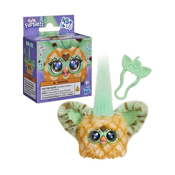 Jucarie interactiva tip Furblets MIN TEE compacta si usor de transport conceputa pentru distractie rapida si interactiune muzicala Produsul reda peste 45 de sunete si efecte audio oferind o experienta dinamica prin activarea diferitelor functii tactile Designul colorat si expresiv atrage atentia iar dimensiunea redusa permite utilizarea oriunde acasa sau in deplasare Este realizat din materiale rezistente potrivite pentru utilizare frecventa Produsul functioneaza pe baza de baterie tip 