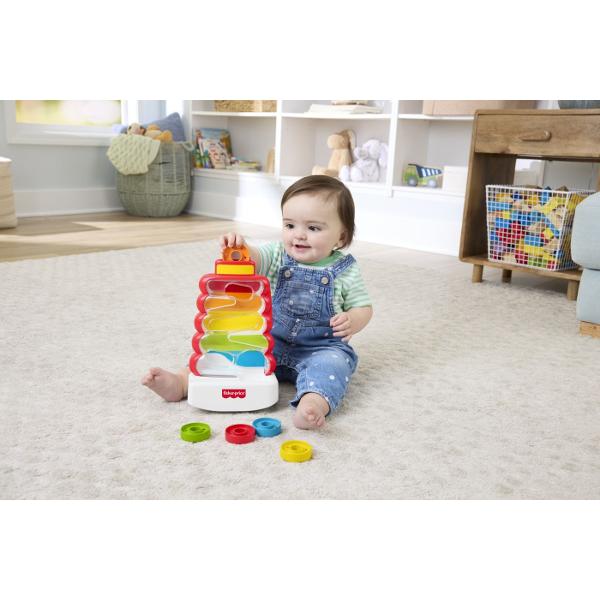 Jucaria Fisher-Price De Dezvoltare Turn Cu Discuri Colorate este special conceput pentru a stimula dezvoltarea timpurie a bebelusilor prin joaca interactiva si plina de culoare Setul include o structura transparenta cu traseu intern si discuri colorate pe care copilul le introduce in partea superioara urmarind cum acestea coboara in mod imprevizibil pana la baza Acest mecanism simplu dar captivant ajuta la dezvoltarea coordonarii mana-ochi si la intelegerea relatiei cauza-efect Designul 