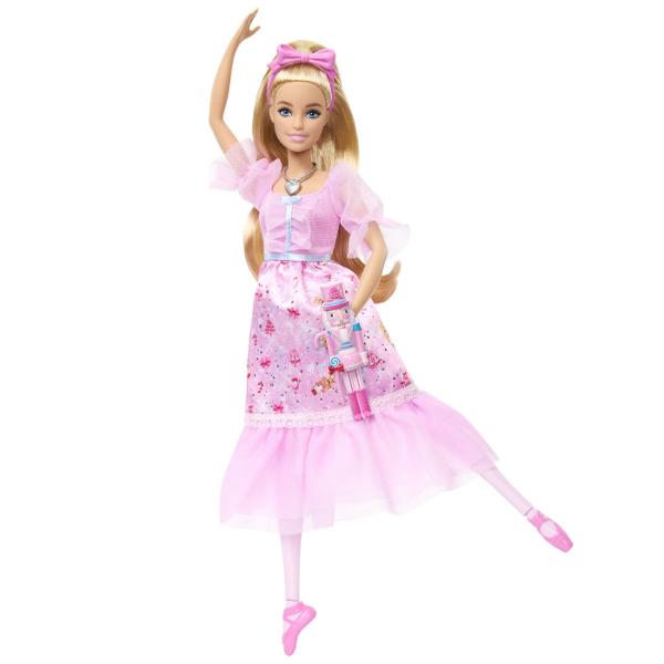 Papusa Clara din colectia Barbie Spargatorul de Nuci este inspirata de povestea clasica si de universul Barbie in the Nutcracker Clara poarta o rochie eleganta de balerina in nuante de roz cu detalii delicate maneci transparente si accesorii asortate completate de pantofi de balet Papusa este prevazuta cu functie de miscare a picioarelor pentru a recrea pozitii si miscari de balet iar setul include si un accesoriu tematic Spargator de Nuci Este potrivita pentru joaca de rol povesti 